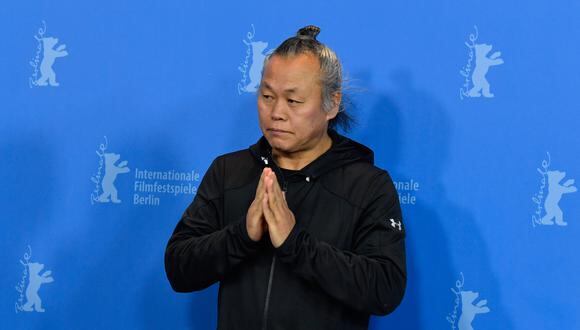 South Korean filmmaker Kim Ki-duk poses during a photocall to present the film "Human, Space, Time and Human" (Inkan, Gonkan, Sikan Grigo Inkan) presented in the Panorama Special section during the 68th Berlinale film festival on February 17, 2018 in Berlin. (Photo by John MACDOUGALL / AFP)
