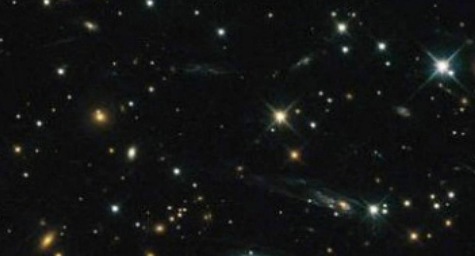 NASA publica impresionante imagen de un cúmulo de galaxias (FOTO