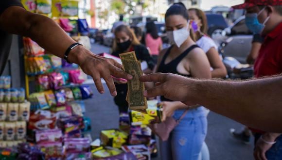 Los analistas estiman que Venezuela puede cerrar 2022 con una inflación de entre 120% y 300%. (Foto: Cristian HERNANDEZ / AFP)