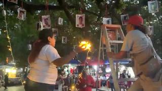Encienden árbol con fotografías de personas desaparecidas en México