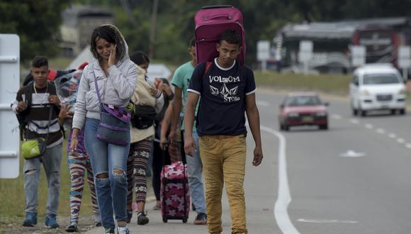 En Colombia hay más de 1,7 millones de venezolanos que salieron de su país en busca de mejores oportunidades porque el suyo está inmerso en una crisis social y económica. (Foto: Raul ARBOLEDA / AFP)