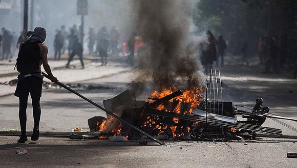 18 muertos y un peruano herido de gravedad tras violentas protestas en Chile