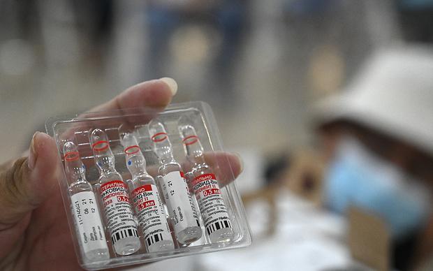 A nurse shows vials of the Sputnik-V vaccine against Govt-19.  (Photo by Orlando Sierra / AFP)