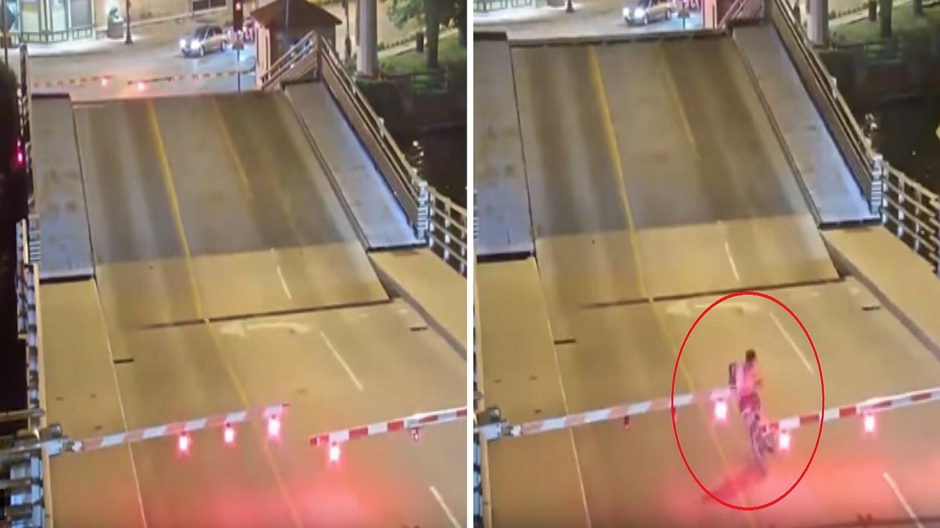 Ciclista trata de pasar por puente levadizo y casi pierde la vida (VÍDEO)