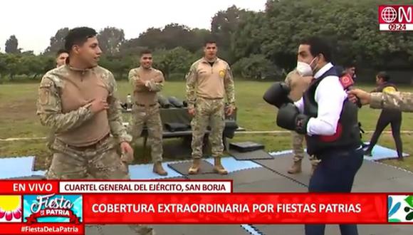 Fernando Llanos, reportero de América TV  y Canal N, tuvo un improvisado encuentro de box con militar. (Foto : Captura)