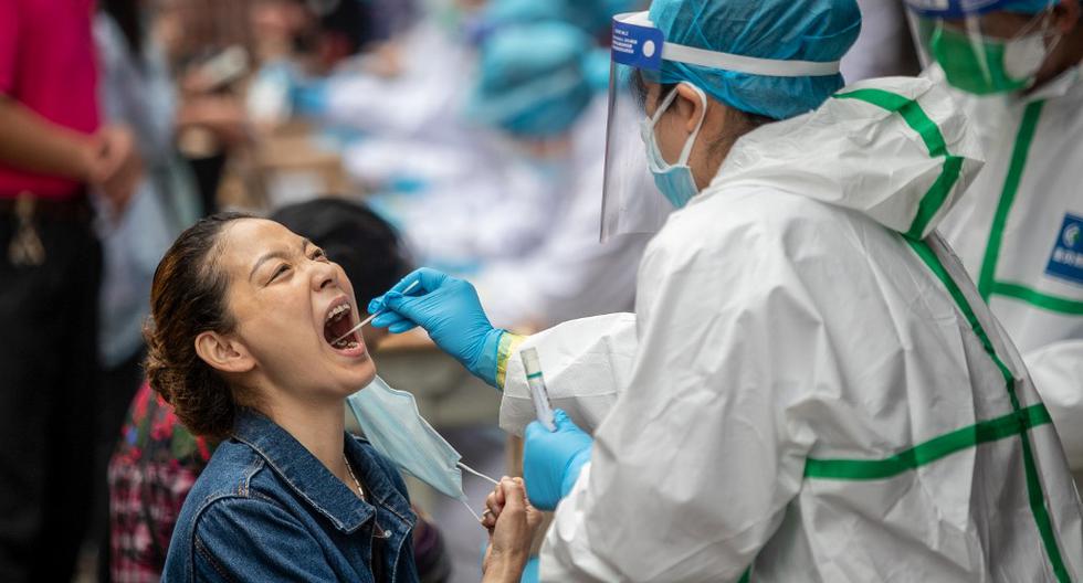 China mantiene la tendencia a la baja de nuevos positivos por coronavirus. (AFP/STR).