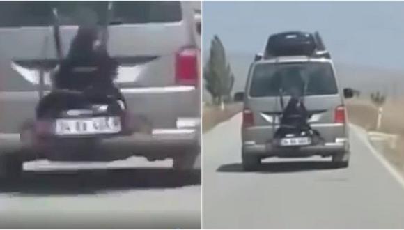 Detienen a hombre que llevaba a su hija atada al portabicicletas de su auto (VIDEO)