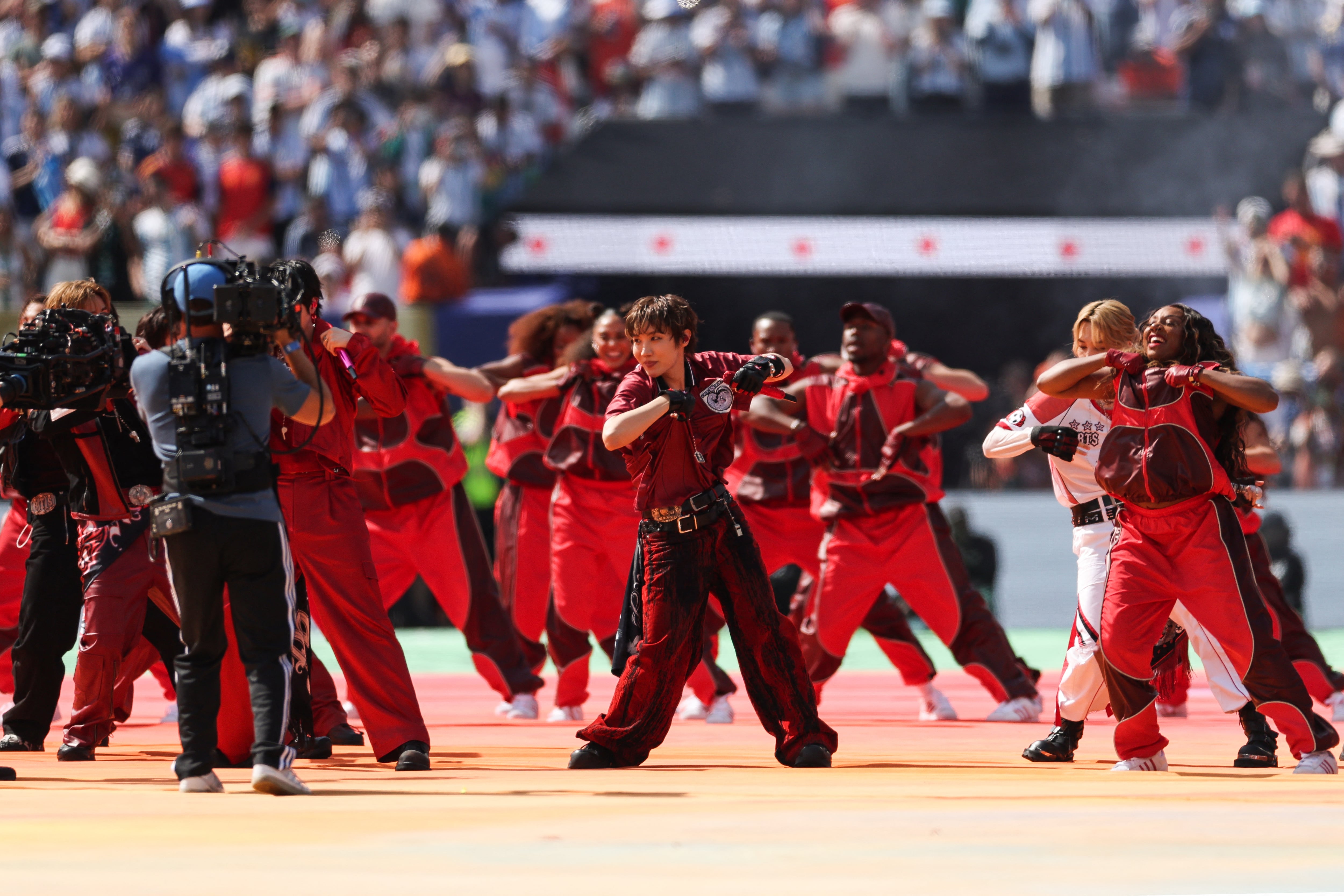 South Korean boy band BTS perform during the halftime show of the 2026 World Cup football tournament final match between Spain and Argentina at the New York/New Jersey Stadium in East Rutherford on July 19, 2026. (Photo by PATRICIA DE MELO MOREIRA / AFP)
