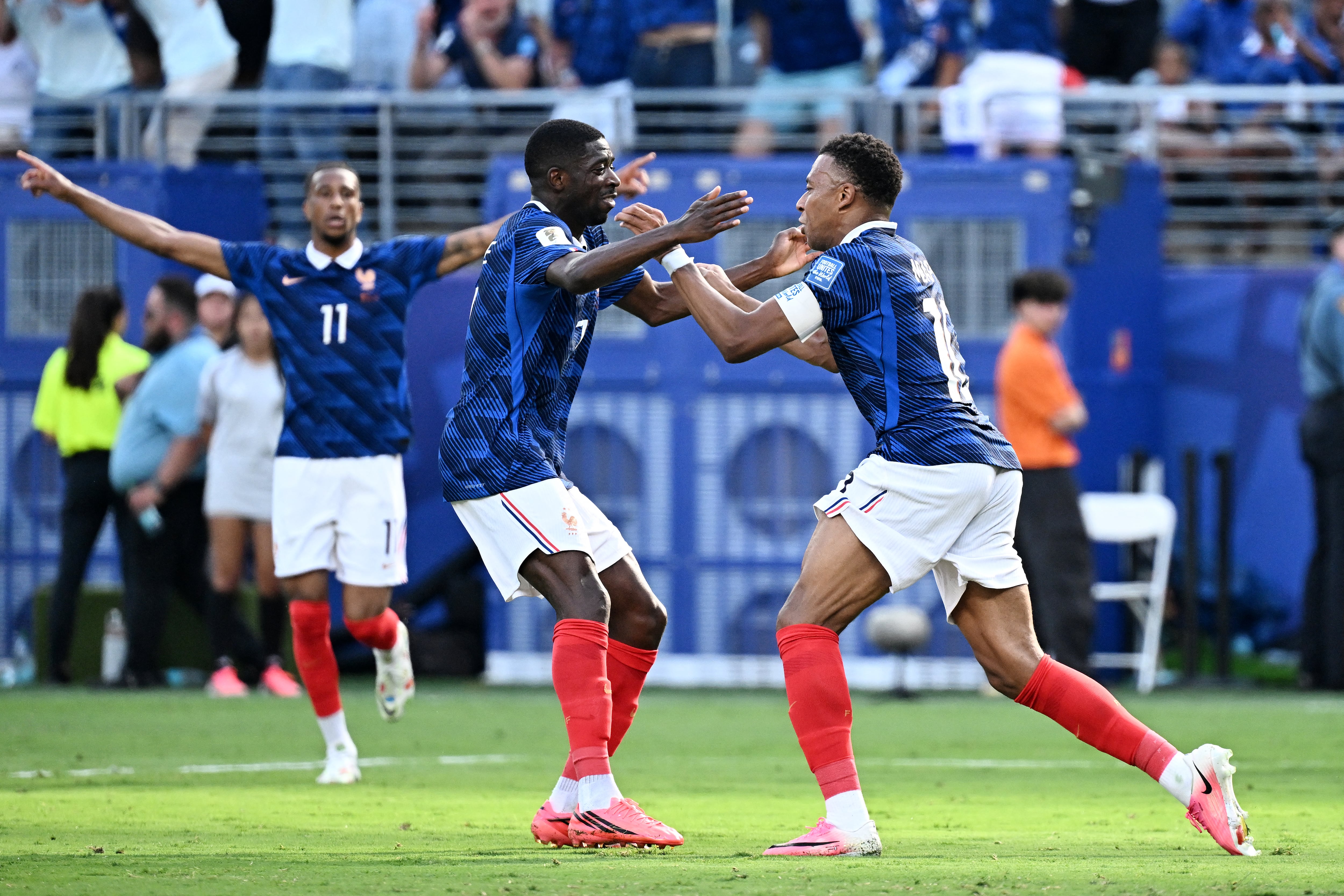 France's forward #10 Kylian Mbappe (R) celebrates scoring his team's first goal with forward #07 Ousmane Dembele during the 2026 World Cup round of 32 football match between France and Sweden at the New York/New Jersey Stadium in East Rutherford on June 30, 2026. (Photo by Jewel SAMAD / AFP)