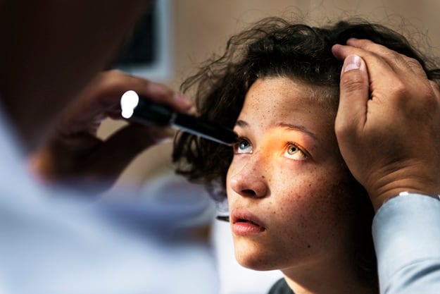 Young Caucasian girl getting an eye examination