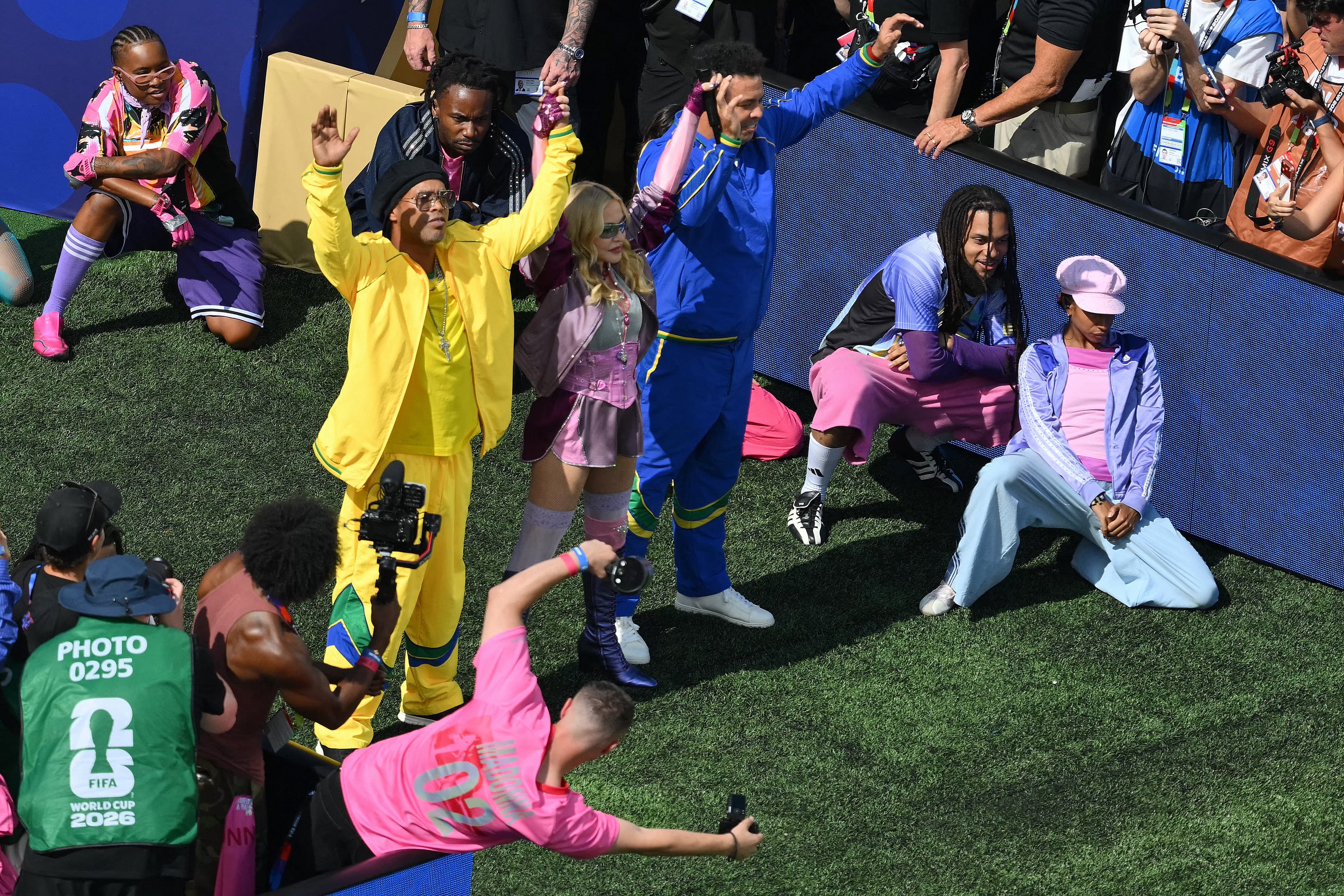 (From Top L) Brazilian footballer Ronaldinho, US singer Madonna and Brazilian former footballer Ronaldo perform during the halftime show of the 2026 World Cup football tournament final match between Spain and Argentina at the New York/New Jersey Stadium in East Rutherford on July 19, 2026. (Photo by ANGELA WEISS / AFP)