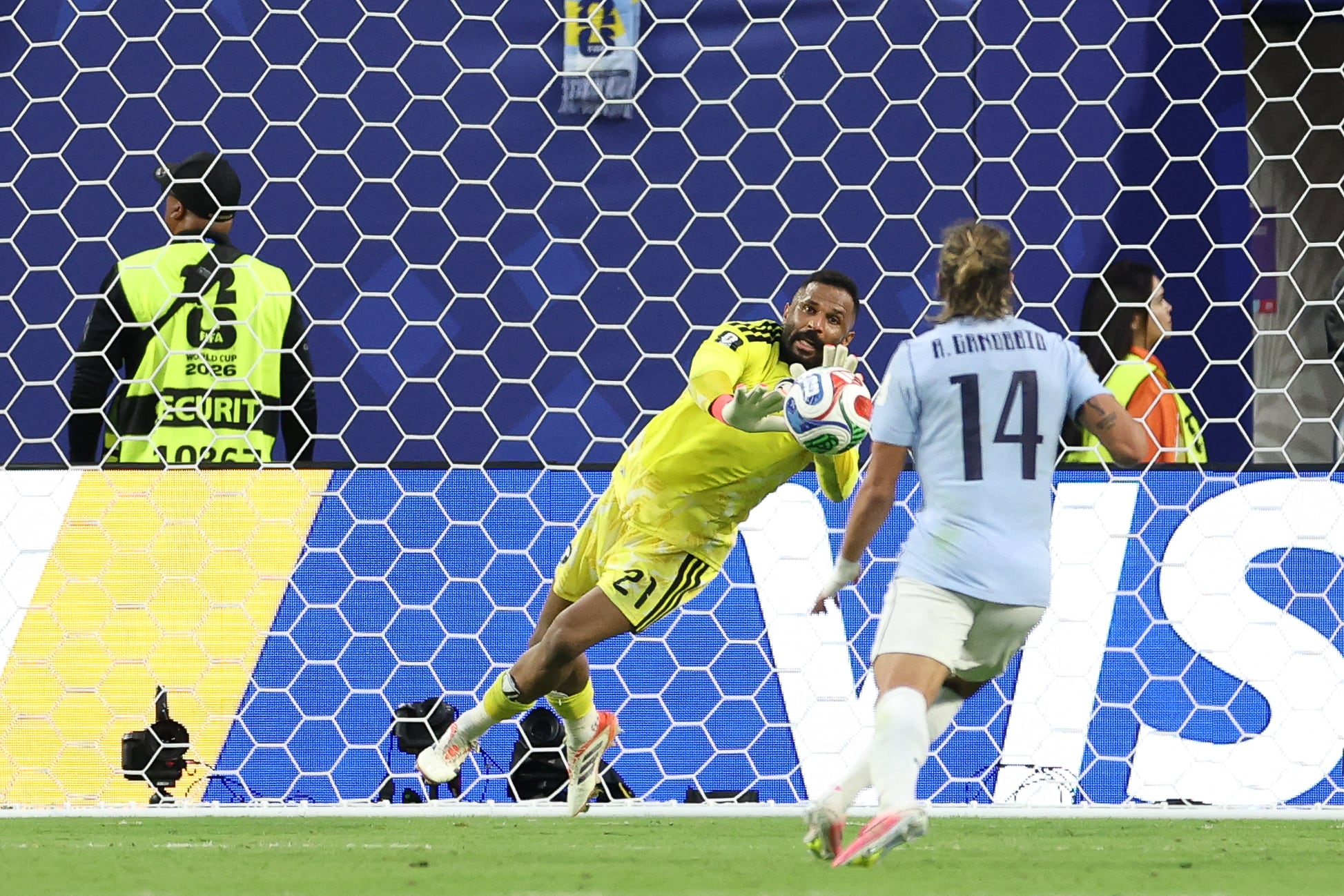 Saudi Arabia's goalkeeper #21 Mohammed Al-Owais makes a save during the 2026 World Cup Group H football match between Saudi Arabia and Uruguay at the Miami Stadium in Miami Gardens on June 15, 2026. (Photo by PATRICIA DE MELO MOREIRA / AFP)
