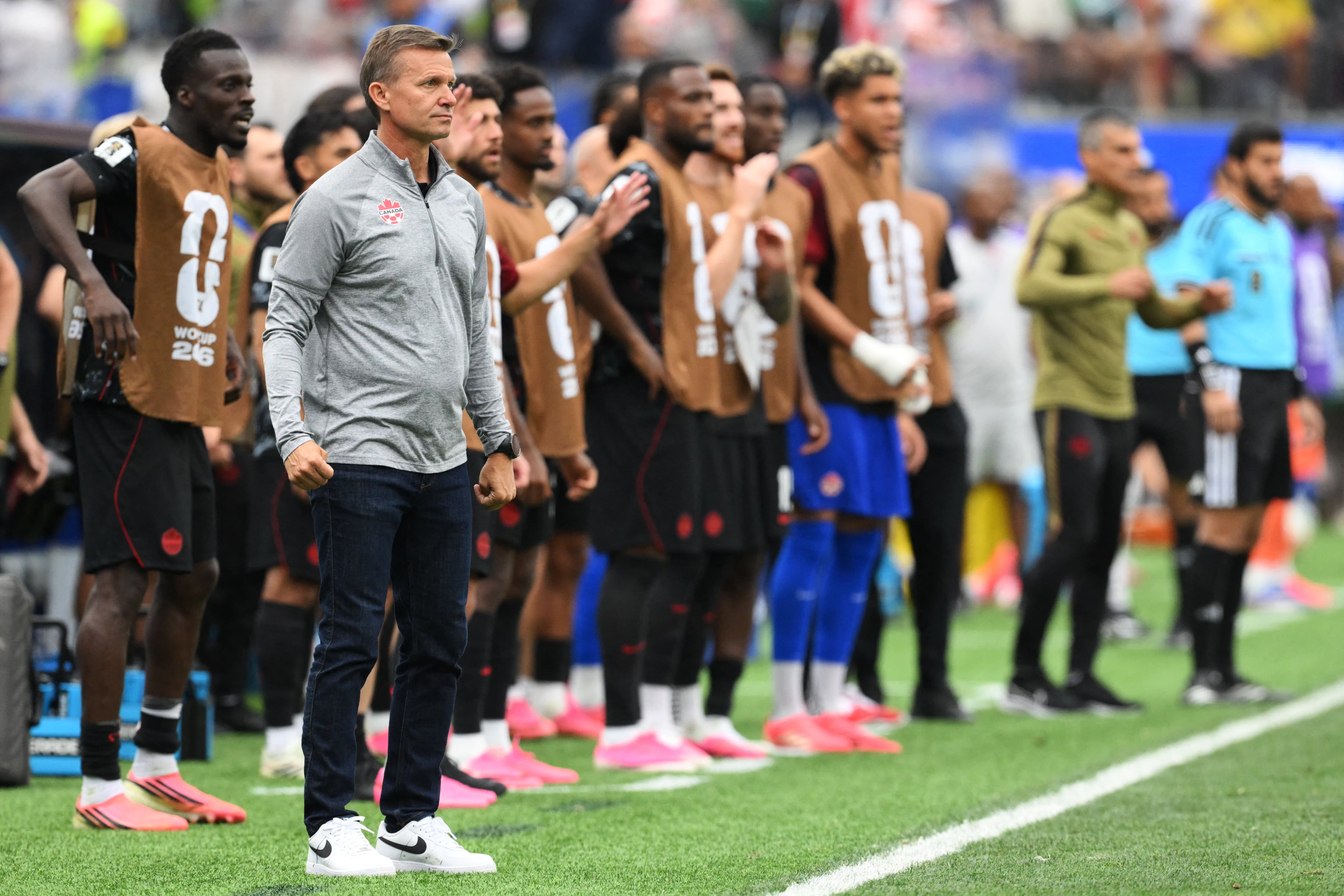 Canada's US head coach Jesse Marsch watches his players from the touchline during the 2026 World Cup round of 32 football match between South Africa and Canada at the Los Angeles Stadium in Inglewood on June 28, 2026. (Photo by Patrick T. Fallon / AFP)