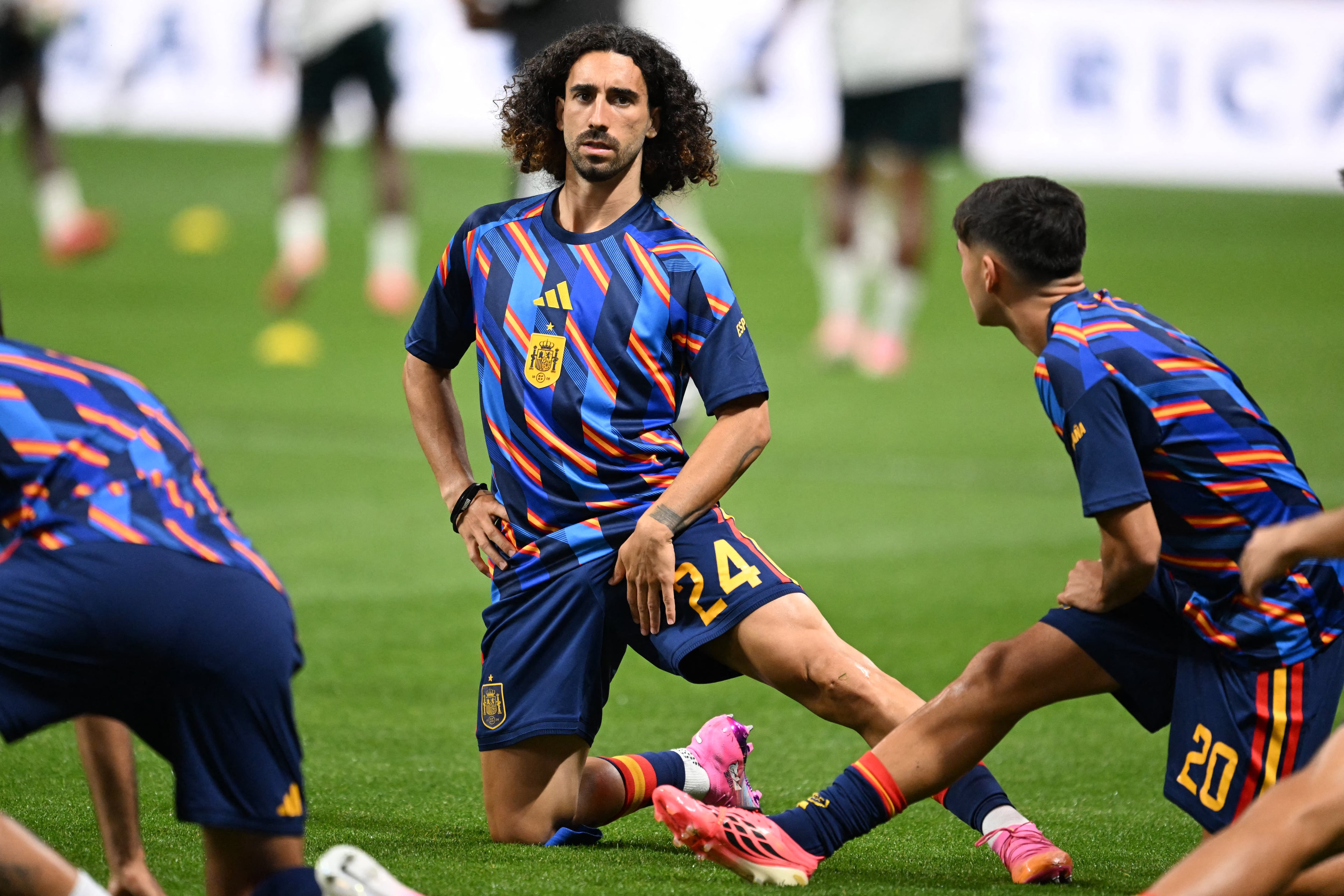 Spain's defender #24 Marc Cucurella warms up prior to the 2026 World Cup Group H football match between Spain and Saudi Arabia at the Atlanta Stadium in Atlanta on June 21, 2026. (Photo by ROBERTO SCHMIDT / AFP)