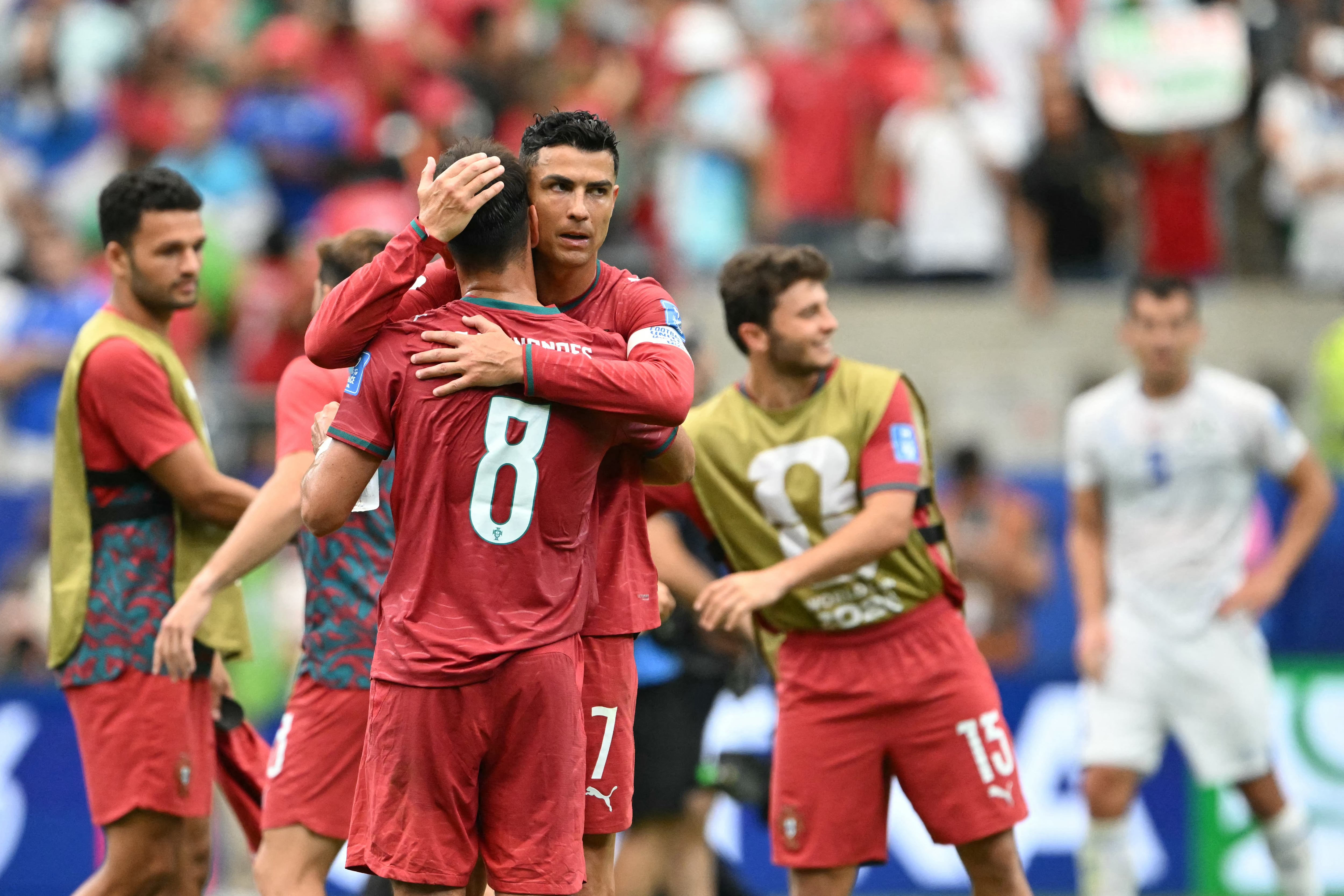 Portugal's forward #07 Cristiano Ronaldo (R) and Portugal's midfielder #08 Bruno Fernandes react after winning the 2026 World Cup Group K football match between Portugal and Uzbekistan at the Houston Stadium in Houston on June 23, 2026. (Photo by RONALDO SCHEMIDT / AFP)