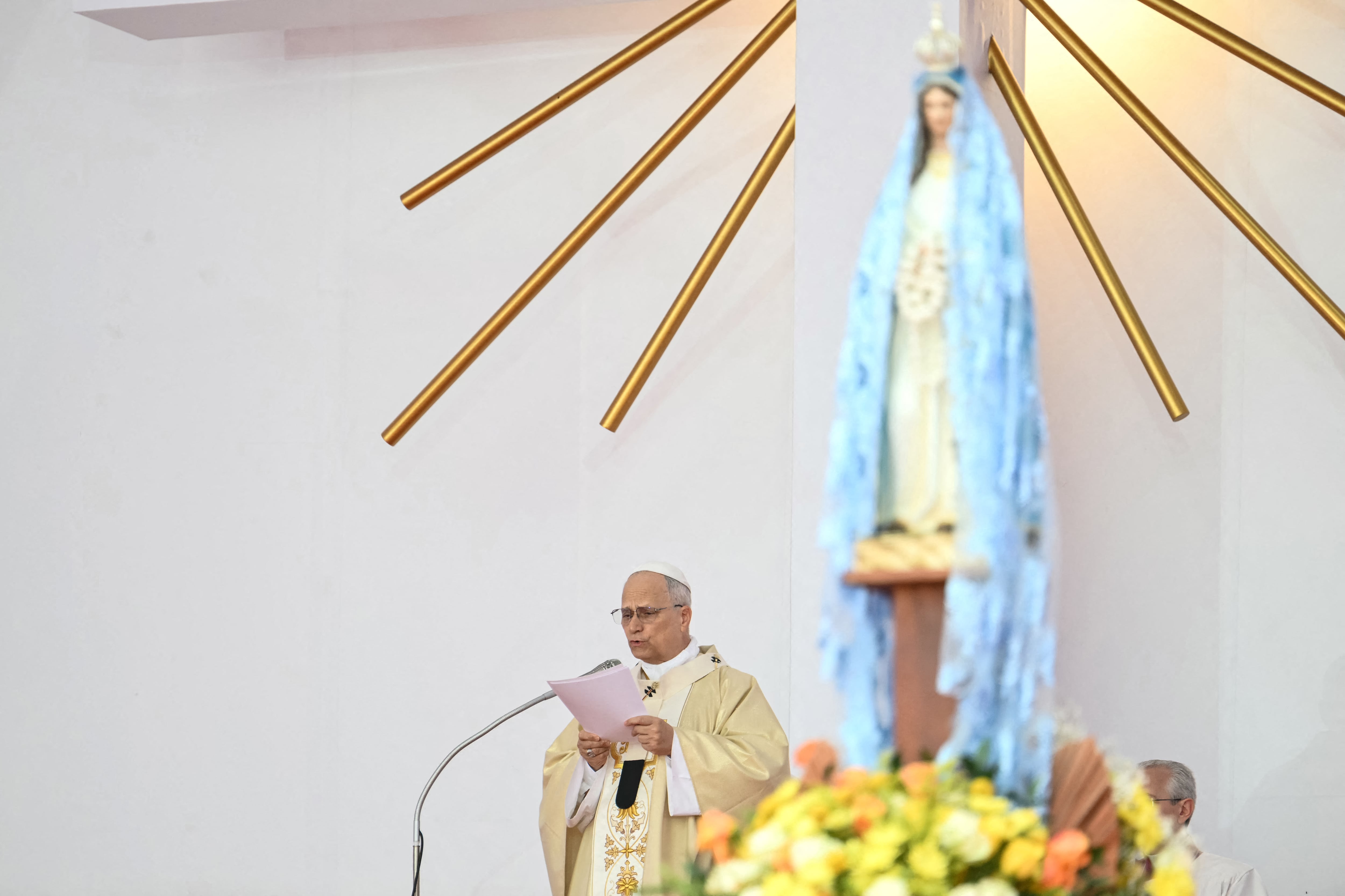 Pope Leo XIV delivers his homily as he leads a Holy Mass in Kilamba on the seventh day of an 11-day apostolic journey to Africa, on April 19, 2026. (Photo by Alberto PIZZOLI / AFP)