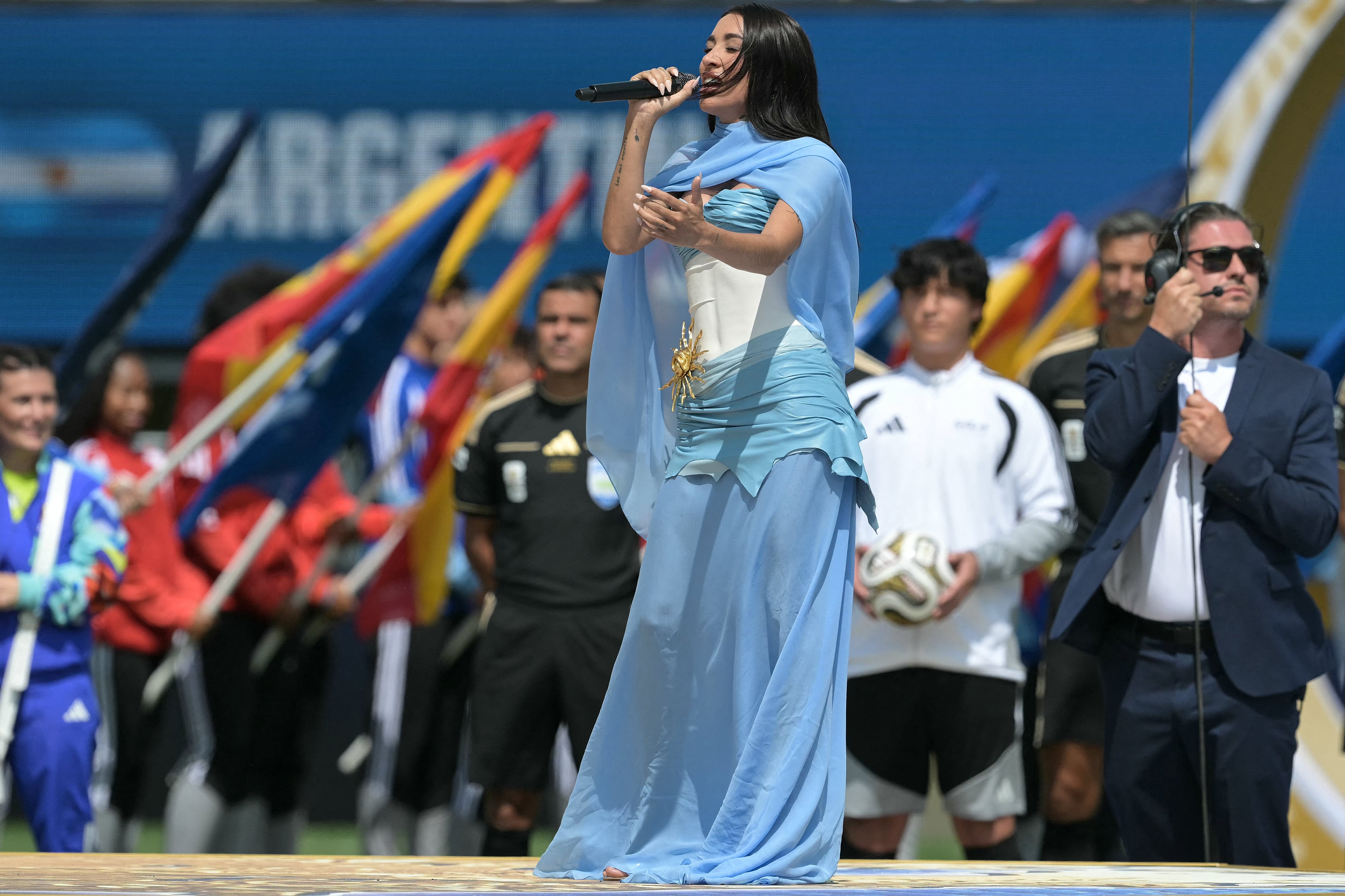 Argentine singer Maria Becerra performs the Argentinian national anthem ahead of the 2026 World Cup football tournament final match between Spain and Argentina at the New York/New Jersey Stadium in East Rutherford on July 19, 2026. (Photo by JUAN MABROMATA / AFP)