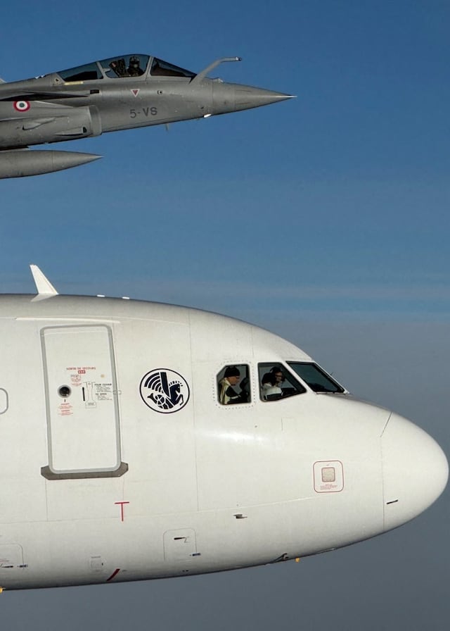 This handout photograph taken on September 28, 2026 and released by France's Armee de l'Air et de l'Espace shows Pope Leo XIV in the cockpit of an Airbus A320 aircraft, flanked by a French Armee de l'Air Rafale fighter jet en route to the Metz�Nancy�Lorraine Airport in Metz, northeastern France, on the last day of th Pope visit to France. Pope Leo XIV spent about 30 minutes in the cockpit of the aircraft that flew him from Lourdes to Metz on September 28, Air France told AFP. (Photo by Handout / Armee de l'Air et de l'Espace francaise / AFP) / RESTRICTED TO EDITORIAL USE - MANDATORY CREDIT "AFP PHOTO / HO / Armee de l'Air et de l'Espace Francaise " - HANDOUT - NO MARKETING NO ADVERTISING CAMPAIGNS - DISTRIBUTED AS A SERVICE TO CLIENTS