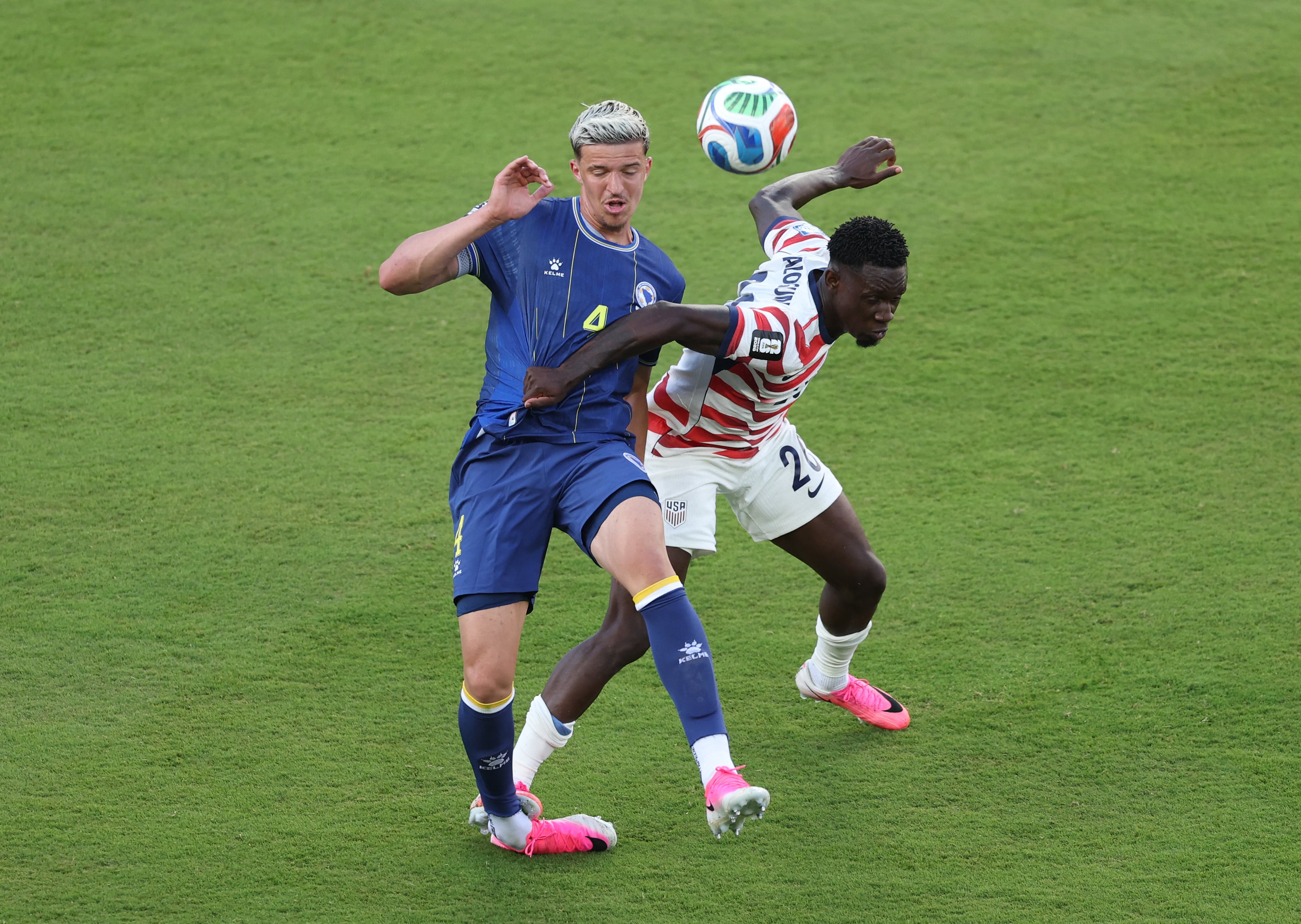 SANTA CLARA, CALIFORNIA - JULY 01: Folarin Balogun #20 of the United States fouls Tarik Muharemovic #4 of Bosnia and Herzegovina which is later reviewed by VAR and awarded as a red card foul a during the FIFA World Cup 2026 Round of 32 match between USA and Bosnia and Herzegovina at San Francisco Bay Area Stadium on July 01, 2026 in Santa Clara, California. Michael Steele/Getty Images/AFP (Photo by MICHAEL STEELE / GETTY IMAGES NORTH AMERICA / Getty Images via AFP)