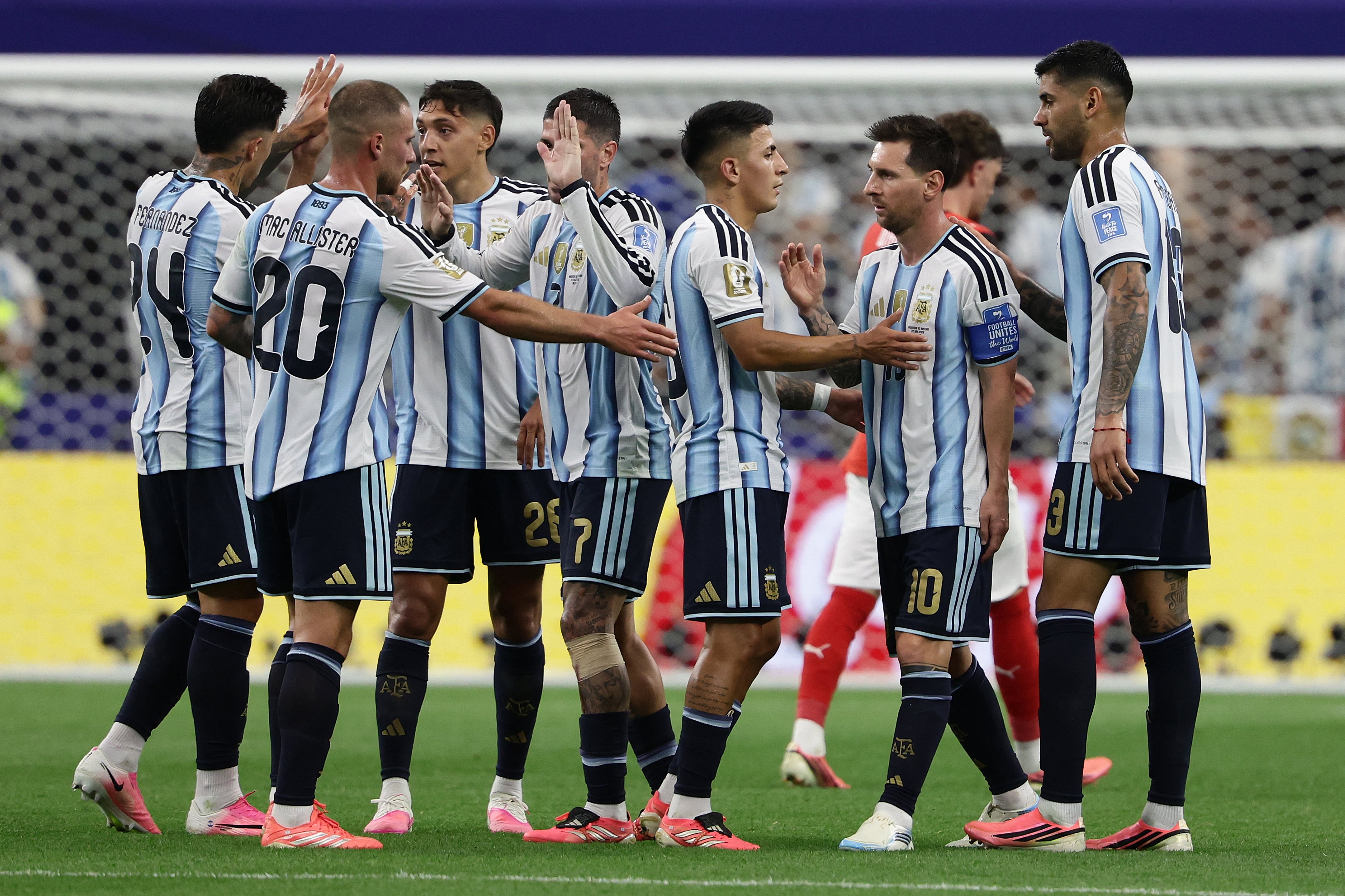 Argentina's forward #10 Lionel Messi (2dnR) and teammates celebrate at half-time of the 2026 World Cup Group J football match between Argentina and Austria at the Dallas Stadium in Arlington on June 22, 2026. (Photo by Aric Becker / AFP)