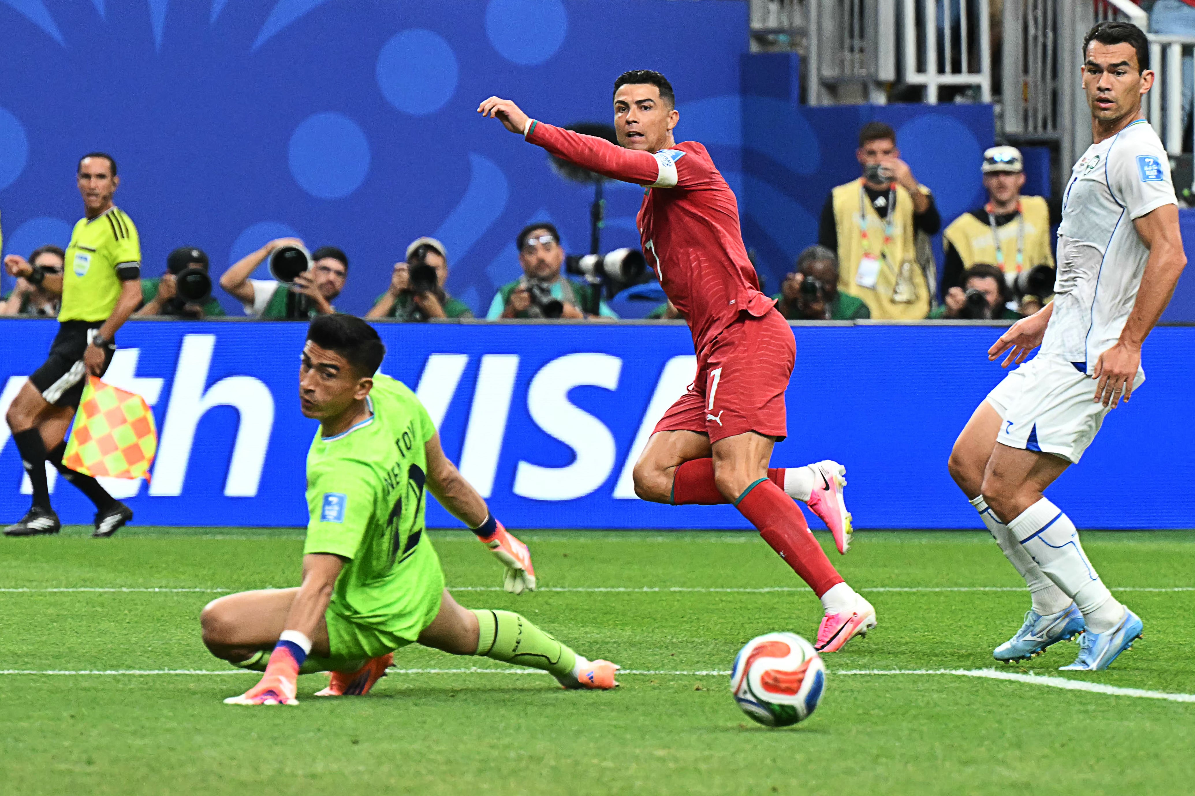 Portugal's forward #07 Cristiano Ronaldo (C) reacts as he scores his team's third goal during the 2026 World Cup Group K football match between Portugal and Uzbekistan at the Houston Stadium in Houston on June 23, 2026. Scotland and Brazil will meet in a 2026 World Cup Group C football match at the Miami Stadium in Miami Gardens on June 24, 2026. (Photo by RONALDO SCHEMIDT / AFP)