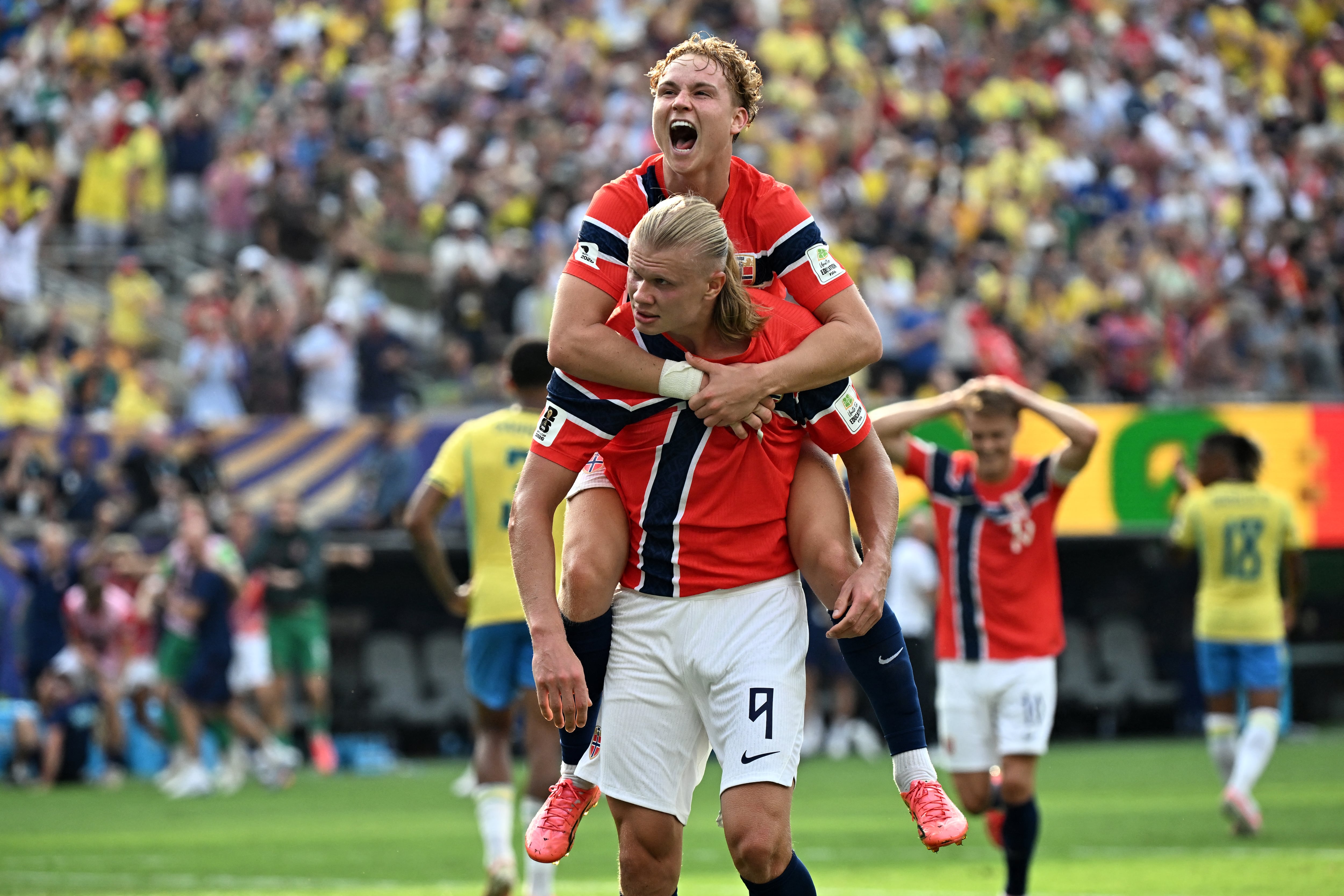 Norway's forward #09 Erling Braut Haaland celebrates scoring his team's second goal with teammate midfielder #21 Andreas Schjelderup during the 2026 World Cup round of 16 football match between Brazil and Norway at the New York/New Jersey Stadium in East Rutherford on July 5, 2026. (Photo by Jewel SAMAD / AFP)