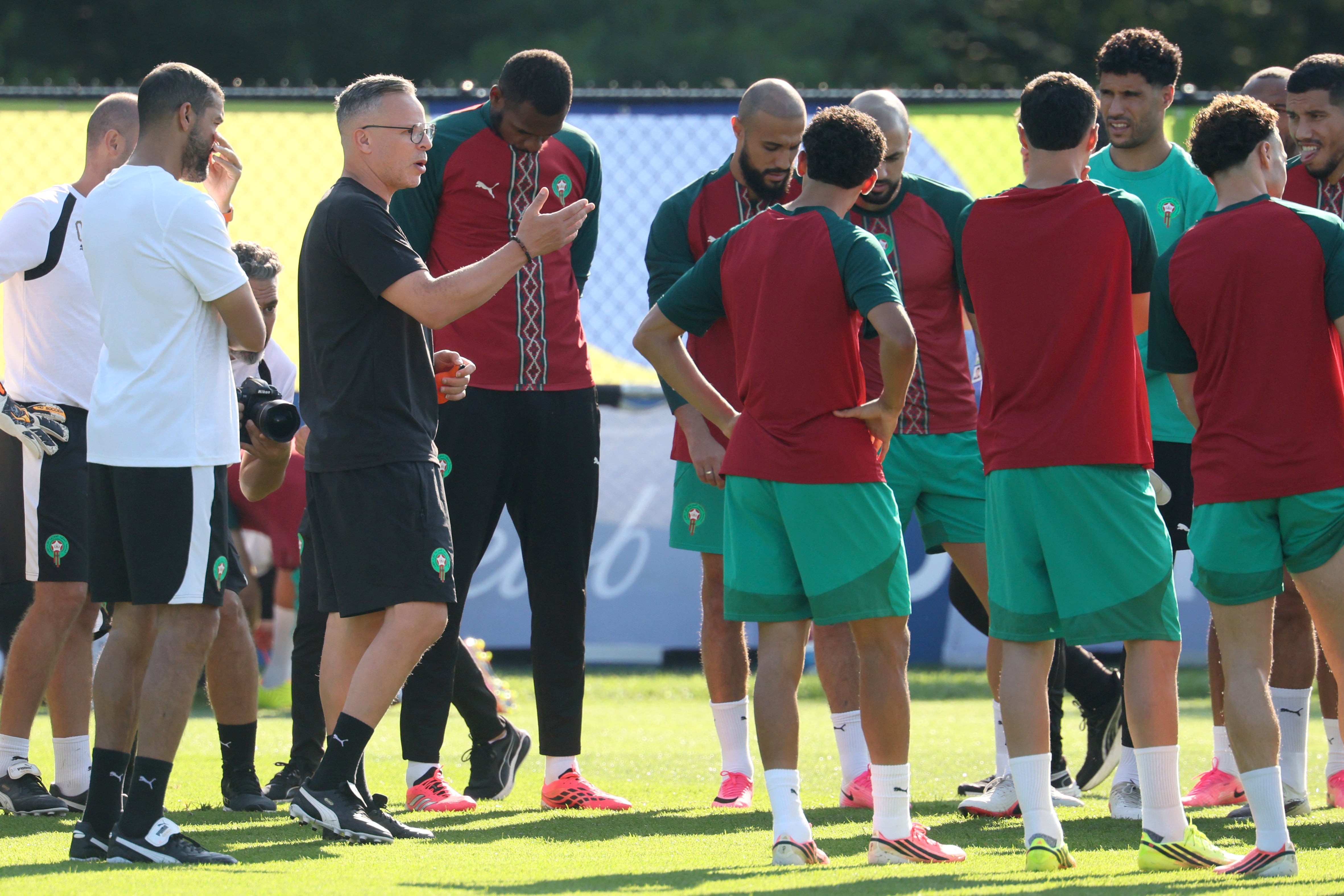 Morocco's head coach Mohamed Ouahbi speaks to his players in an MD-1 training session at New England Revolution Training Centre in Foxborough, near Boston, on July 8, 2026, on the eve of the 2026 World Cup football tournament quarter-final match between France and Morocco. (Photo by Odd ANDERSEN / AFP)