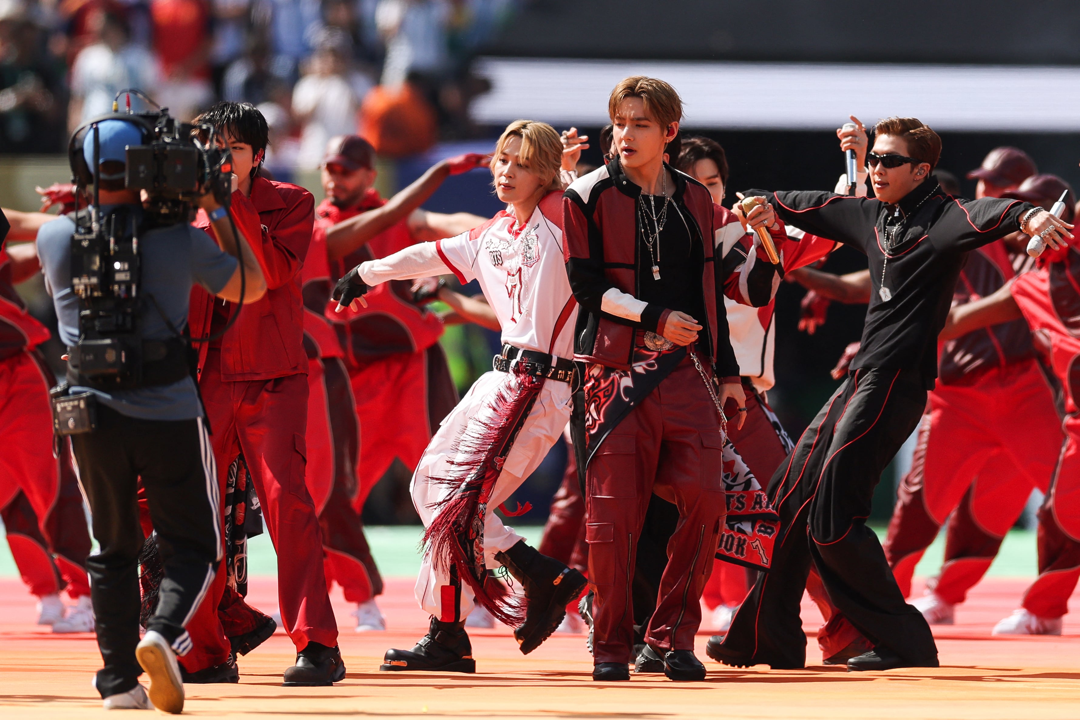 South Korean boy band BTS perform during the halftime show of the 2026 World Cup football tournament final match between Spain and Argentina at the New York/New Jersey Stadium in East Rutherford on July 19, 2026. (Photo by PATRICIA DE MELO MOREIRA / AFP)