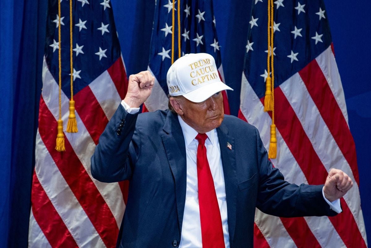 Former US President Donald Trump dances during a campaign event at Simpson College in Indianola, Iowa, US, on Sunday, Jan. 14, 2024. Trump heads into the Iowa caucuses Monday with a commanding 48% support in a closely watched poll that showed Nikki Haley moving into second place with 20%.
