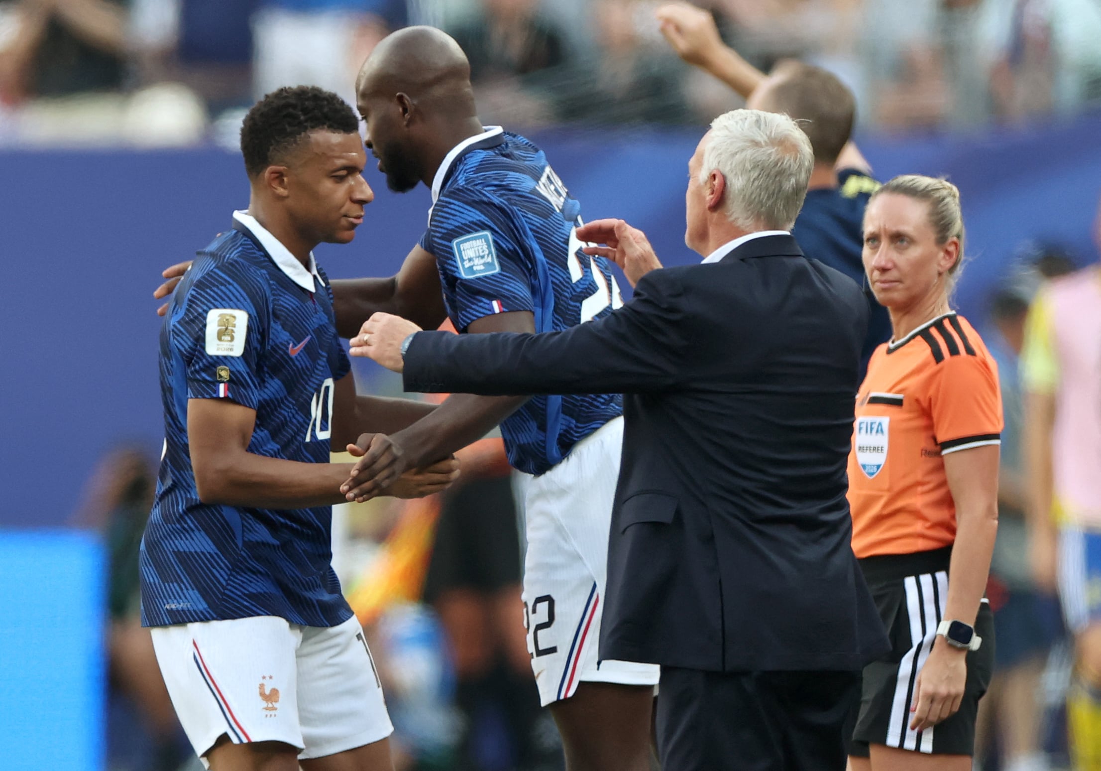 France's forward #10 Kylian Mbappe greets his coach Didier Deschamps after being substituted during the 2026 World Cup round of 32 football match between France and Sweden at the New York/New Jersey Stadium in East Rutherford on June 30, 2026. (Photo by FRANCK FIFE / AFP)