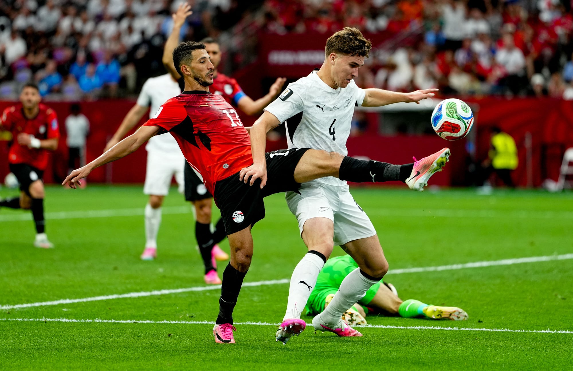 VANCOUVER, CANADA - JUNE 21: Egypt's Marwan Hamdy (13) challenges New Zealand's Finn Surman (4) for the ball during the 2026 FIFA World Cup Group G match between Egypt and New Zealand in Vancouver, Canada, on June 21, 2026. Ercin Erturk / Anadolu (Photo by Ercin Erturk / Anadolu via AFP)