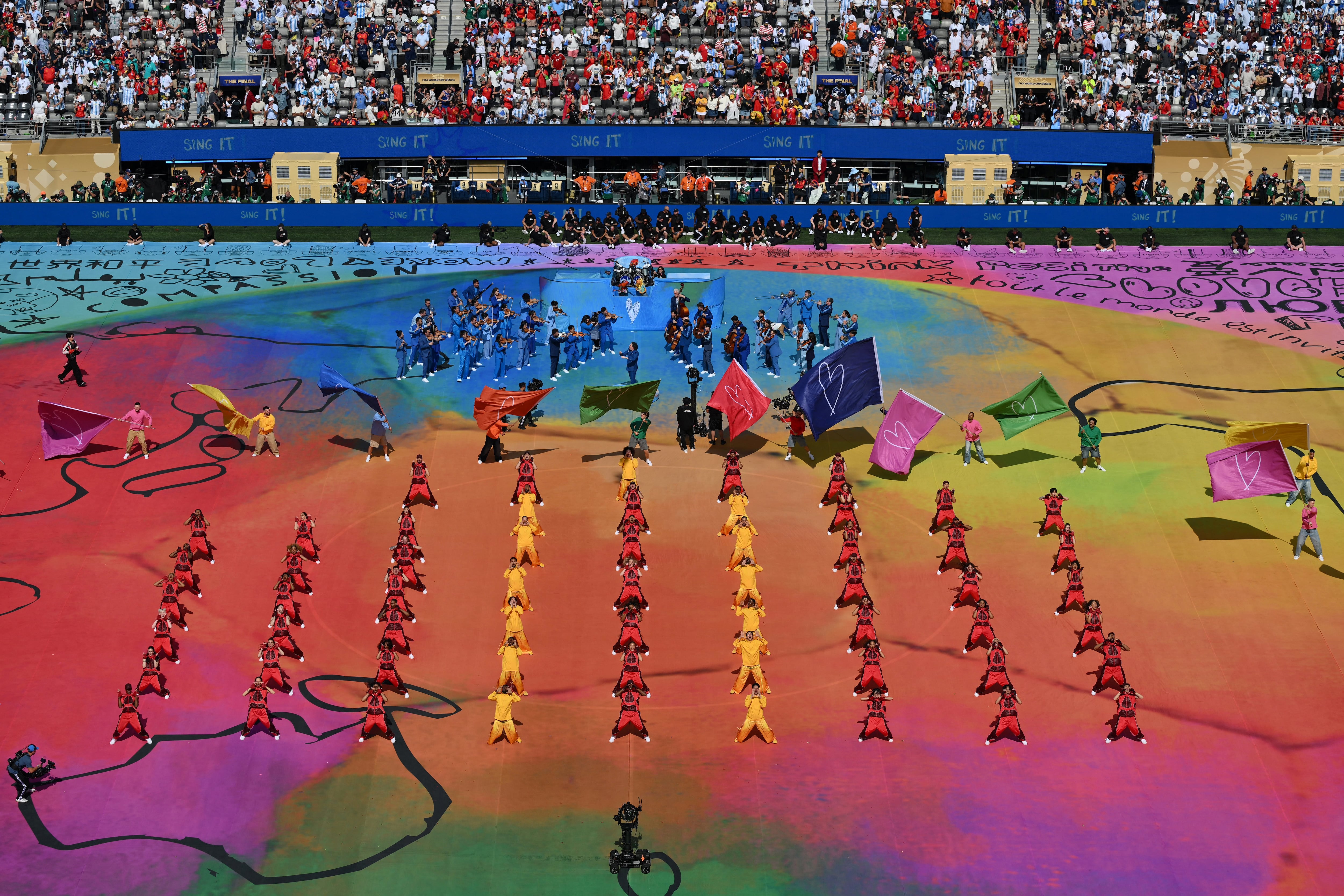 Venezuelan conductor Gustavo Dudamel, musicians and dancers perform during the halftime show of the 2026 World Cup football tournament final match between Spain and Argentina at the New York/New Jersey Stadium in East Rutherford on July 19, 2026. (Photo by ANGELA WEISS / AFP)