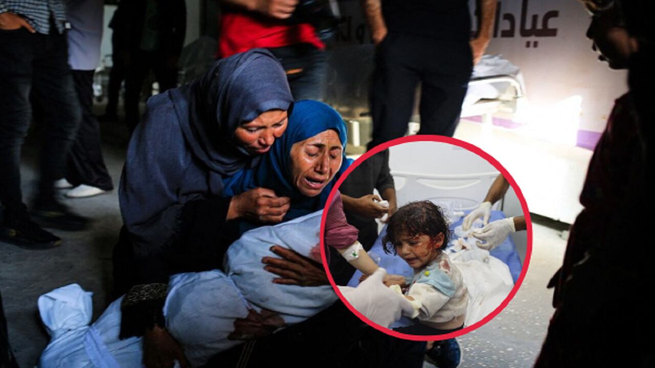 Una mujer palestina sostiene el cuerpo amortajado de un niño muerto en un bombardeo israelí, en una clínica de salud en el área de Tel al-Sultan en Rafah, en el sur de la Franja de Gaza, el 26 de mayo de 2024. (Foto de Eyad BABA / AFP)