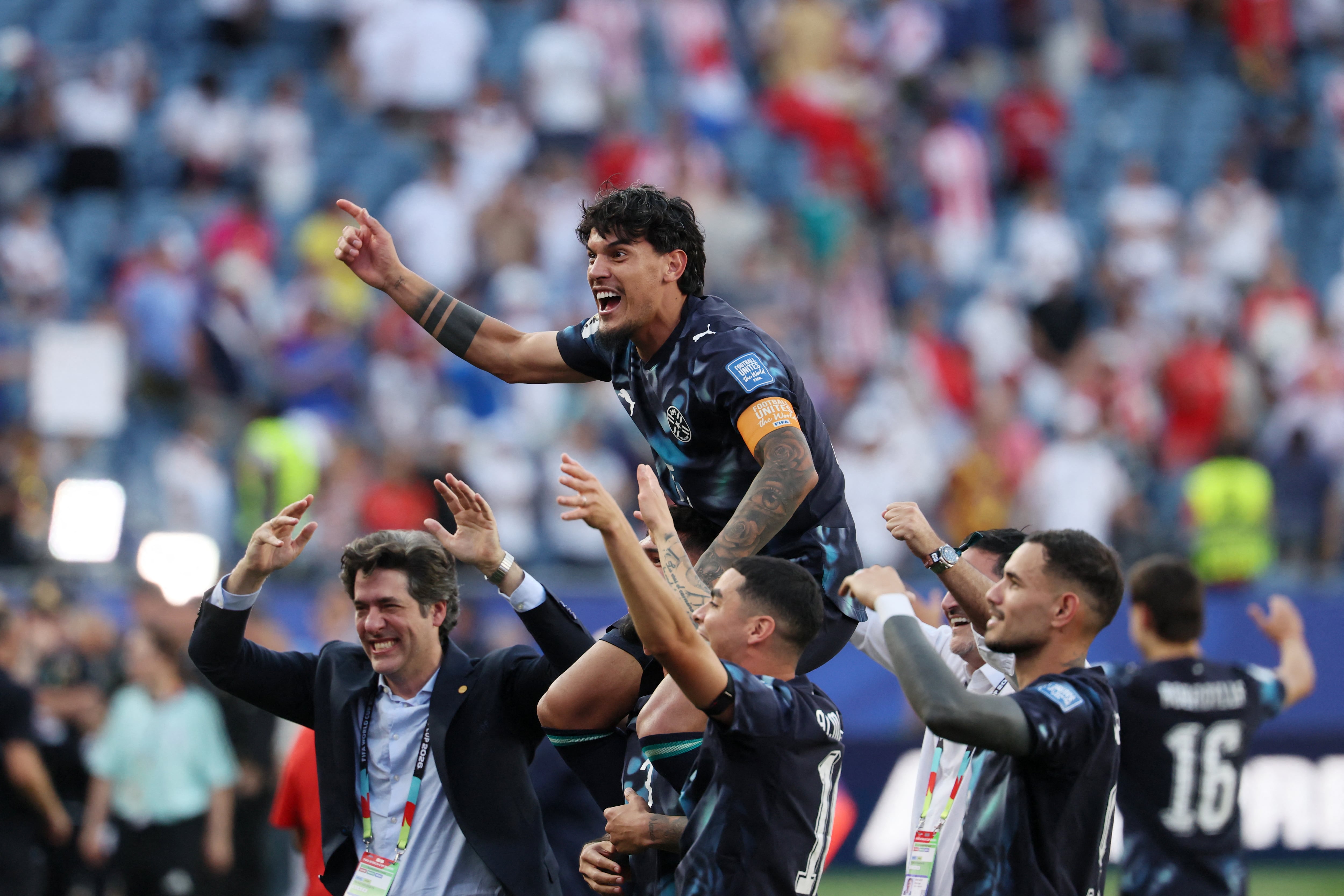 Paraguay's defender #15 Gustavo Gomez (C) and teammates celebrate after winning the penalty shootout of the 2026 World Cup round of 32 football match between Germany and Paraguay at the Boston Stadium in Foxborough on June 29, 2026. (Photo by Odd ANDERSEN / AFP)
