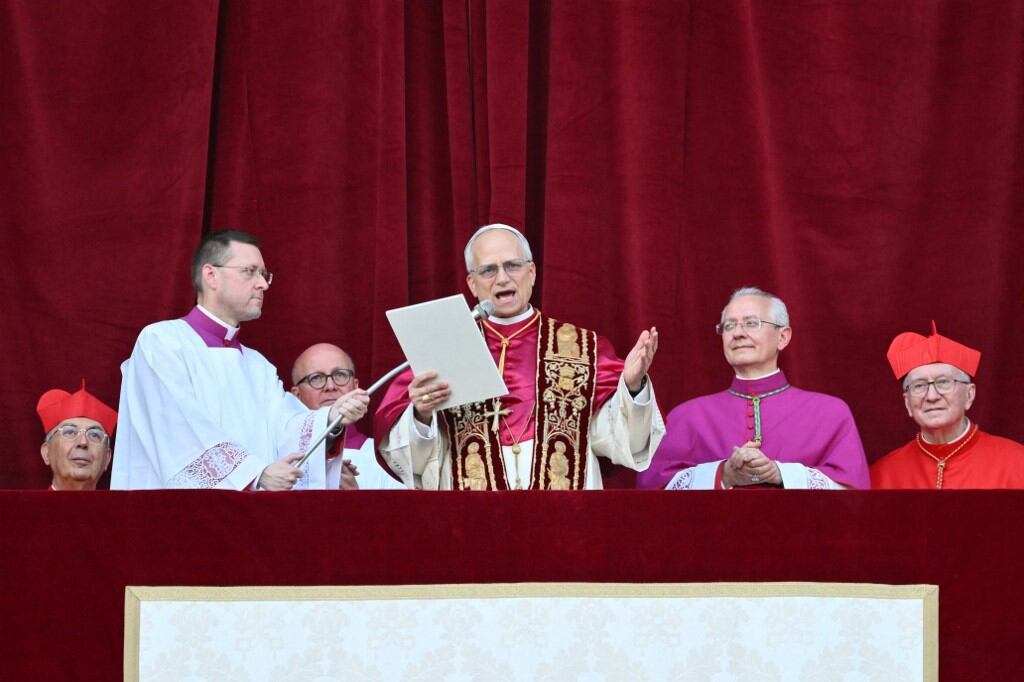 Newly elected Pope Leo XIV, Robert Prevost addresses the crowd from the main central loggia balcony of the St Peter's Basilica for the first time, after the cardinals ended the conclave, in The Vatican, on May 8, 2025. Robert Francis Prevost was on Thursday elected the first pope from the United States, the Vatican announced. A moderate who was close to Pope Francis and spent years as a missionary in Peru, he becomes the Catholic Church's 267th pontiff, taking the papal name Leo XIV. (Photo by Alberto PIZZOLI / AFP)