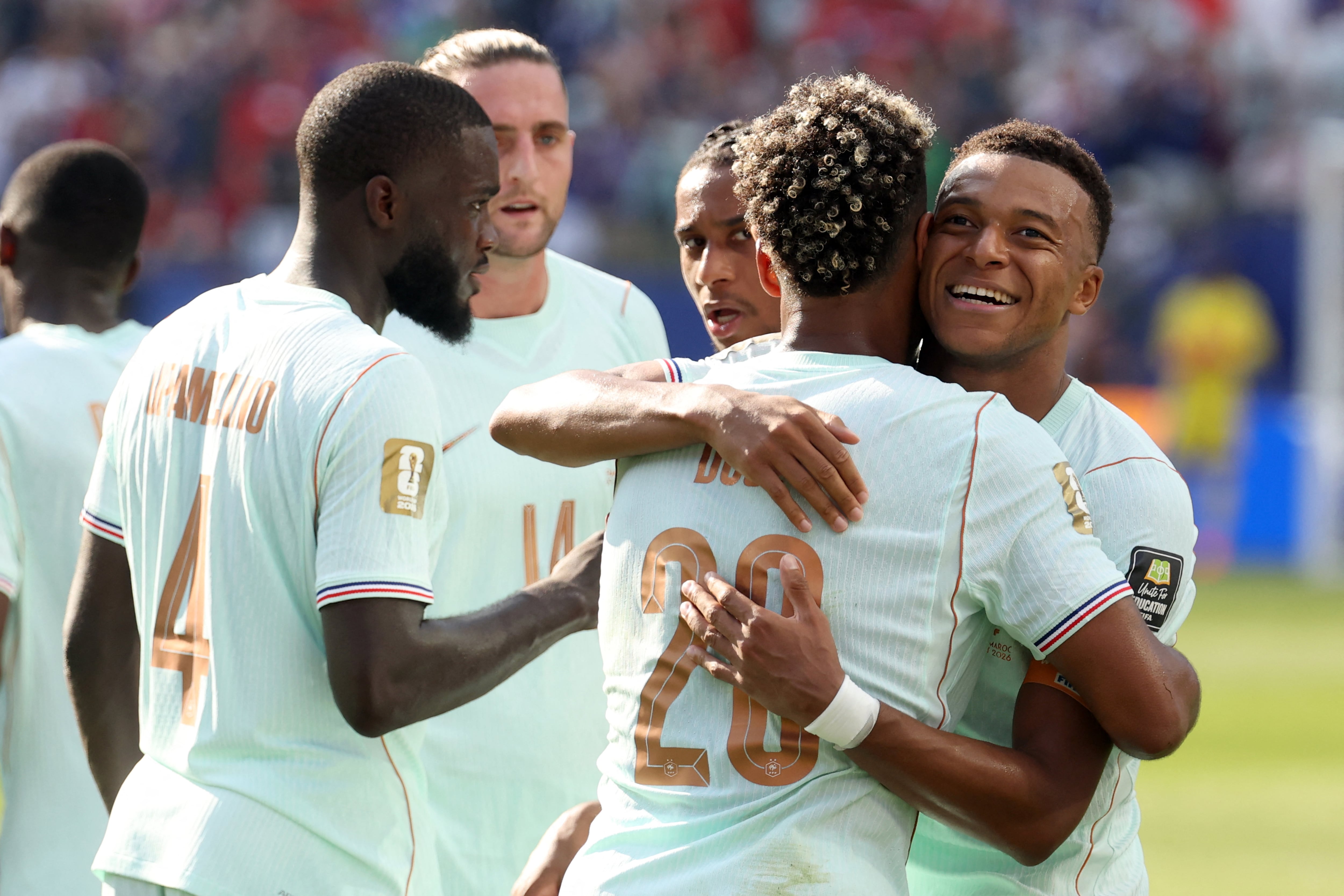 France's forward #10 Kylian Mbappe (R) celebrates scoring his team's first goal with teammate forward #20 Desire Doue during the 2026 World Cup football tournament quarter-final match between France and Morocco at Boston Stadium in Foxborough on July 9, 2026. (Photo by Odd ANDERSEN / AFP)