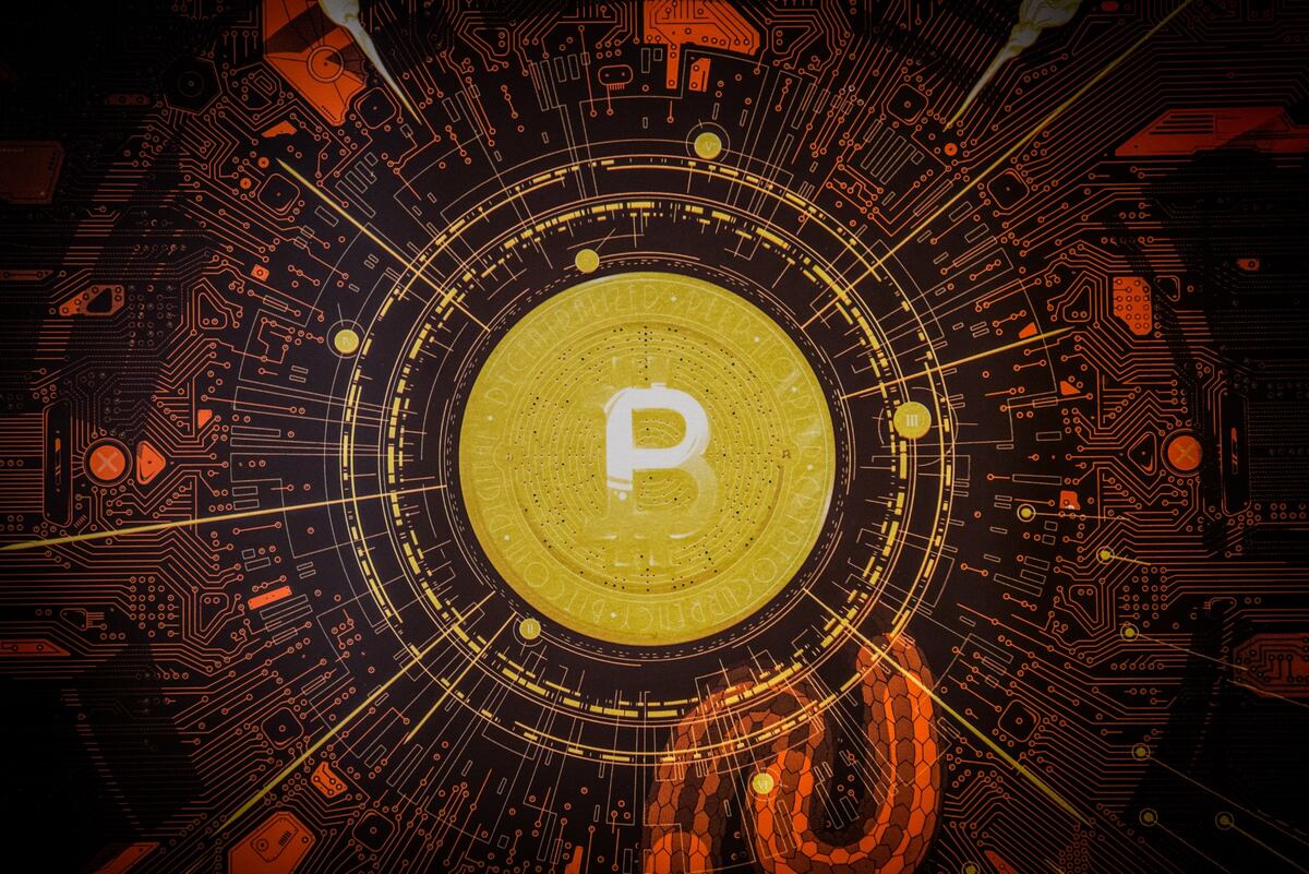 A Bitcoin logo inside a cryptocurrency exchange in Barcelona, Spain, on Wednesday, March 9, 2022. Bitcoin dropped back below $40,000, erasing almost all the gains sparked by optimism about U.S. President Joe Bidens executive order to put more focus on the crypto sector. Photographer: Angel Garcia/Bloomberg