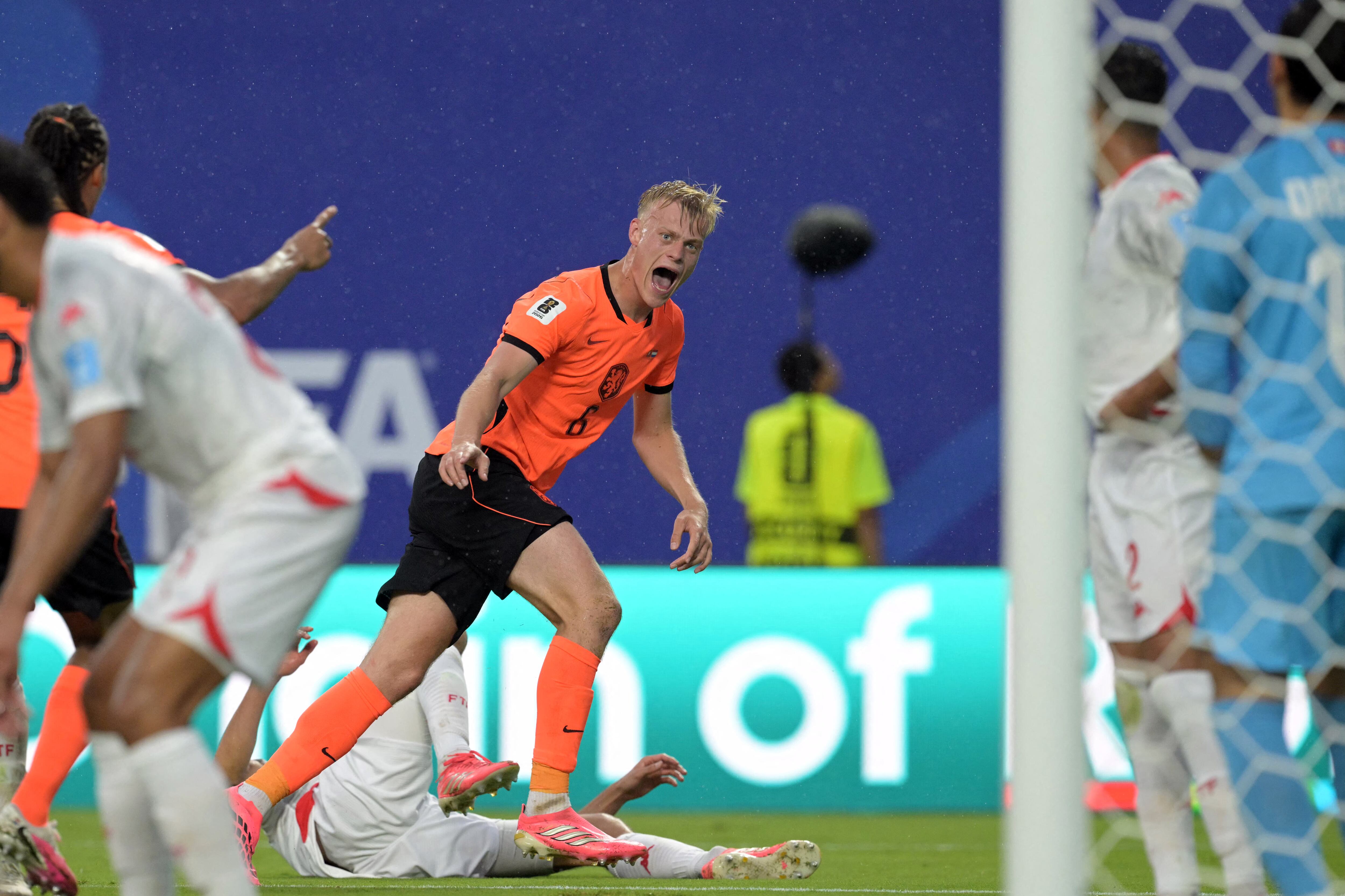 Netherlands' defender #06 Jan Paul Van Hecke celebrates scoring his team's third goal during the 2026 World Cup Group F football match between Tunisia and the Netherlands at the Kansas City Stadium in Kansas City on June 25, 2026. (Photo by JUAN MABROMATA / AFP)